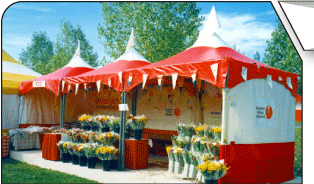 Several Red,White,Yellow MQ10 Tents joined to make a great Sales kiosk tent