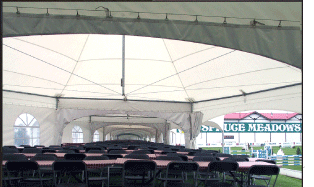 Interior view of a group of White Hexagonal Peak Marquee Tents linked with gutters