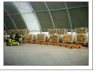 Inside picture of equipment storage in a fabric structure steel building