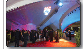 Arabesque Triad with theatrical lighting projection at night