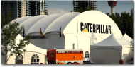White canpopy Catepiller ClearSpan Branded Logo Graphics Tent, Calgary (Mod 4x), angle view, late evening