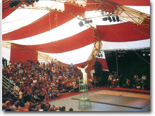 1987 Vancouver children festival, inside a Arabesque Theatre Tent, Childrens performer performing a stacking chair stunt