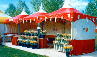 Several Red,White,Yellow MQ10 Tents joined to make a great Sales kiosk tent